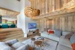 Experience luxury living in this stunning property featuring a cozy living room with a modern design.