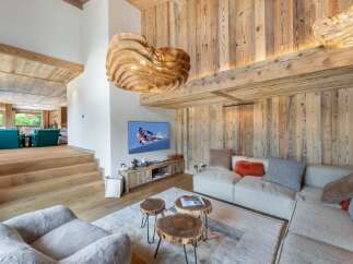 Experience luxury living in this stunning property featuring a cozy living room with a modern design.