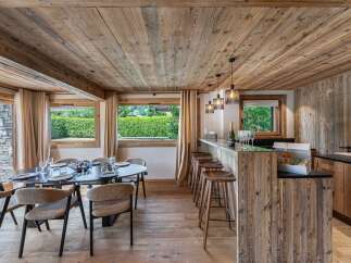Experience rustic elegance in this stunning property, featuring a beautifully designed dining area and a stylish bar.