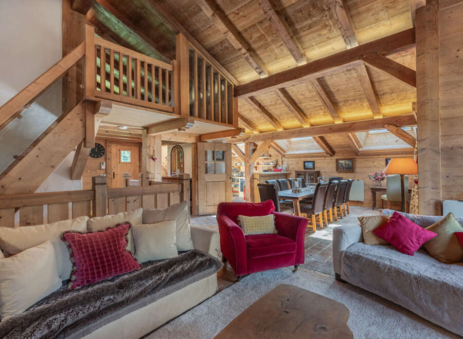 Experience the charm of this stunning property, featuring a beautifully designed interior with exposed wooden beams and a cozy ambiance.