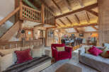 Experience the charm of this stunning property, featuring a beautifully designed interior with exposed wooden beams and a cozy ambiance.
