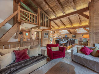 Experience the charm of this stunning property, featuring a beautifully designed interior with exposed wooden beams and a cozy ambiance.