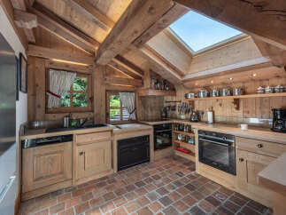 Step into this charming kitchen, a perfect blend of rustic elegance and modern convenience.