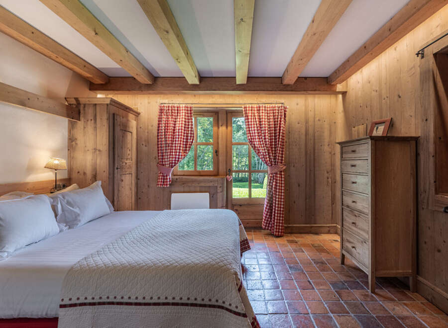 Step into rustic elegance with this charming bedroom.