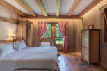 Step into rustic elegance with this charming bedroom.