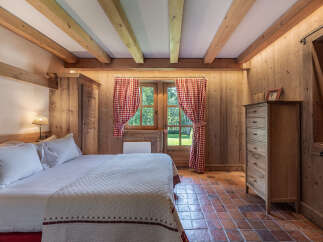 Step into rustic elegance with this charming bedroom.