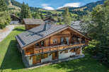 Discover the charm of this stunning wooden chalet nestled in a picturesque mountain setting.