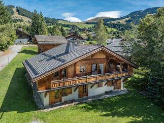 Discover the charm of this stunning wooden chalet nestled in a picturesque mountain setting.