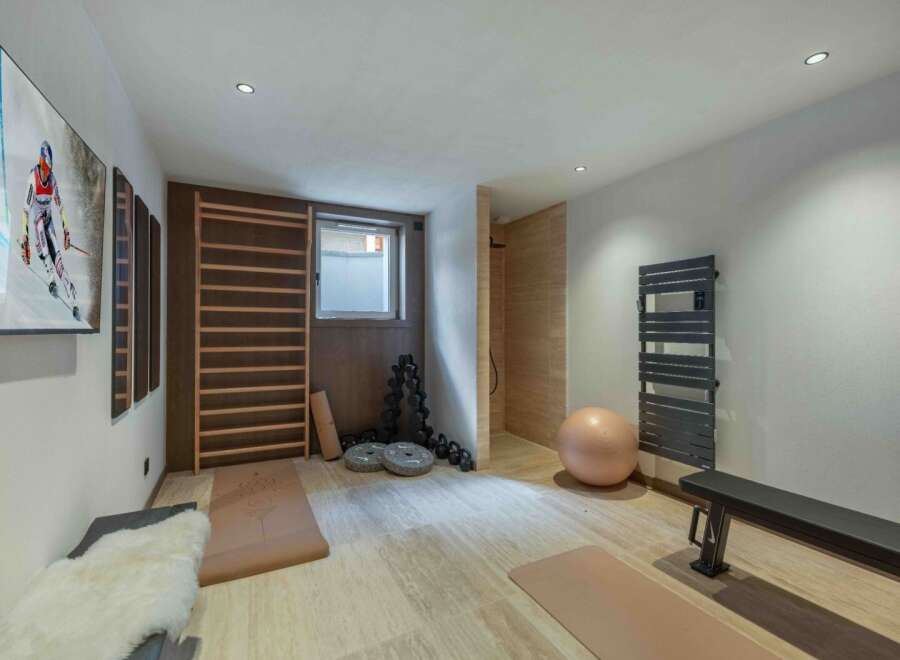 This modern home gym offers a serene space for fitness and relaxation.