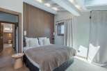 This stunning bedroom boasts a modern design with a touch of rustic charm.