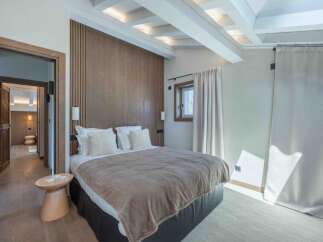 This stunning bedroom boasts a modern design with a touch of rustic charm.