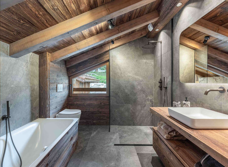 This stunning bathroom showcases rustic elegance with its wooden accents and modern design.