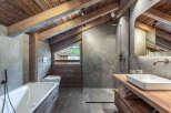 This stunning bathroom showcases rustic elegance with its wooden accents and modern design.