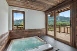 Indulge in luxury with this stunning property featuring a private hot tub and breathtaking mountain views.