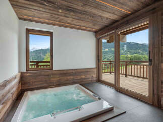 Indulge in luxury with this stunning property featuring a private hot tub and breathtaking mountain views.