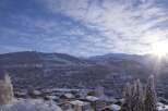 Nestled in a picturesque winter wonderland, this property offers stunning views of snow-capped mountains and a charming village.