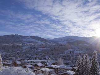 Nestled in a picturesque winter wonderland, this property offers stunning views of snow-capped mountains and a charming village.