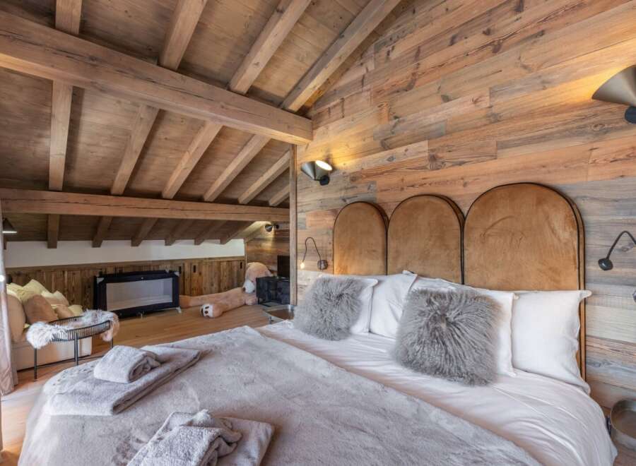 Experience rustic luxury in this stunning bedroom.