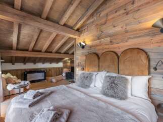 Experience rustic luxury in this stunning bedroom.