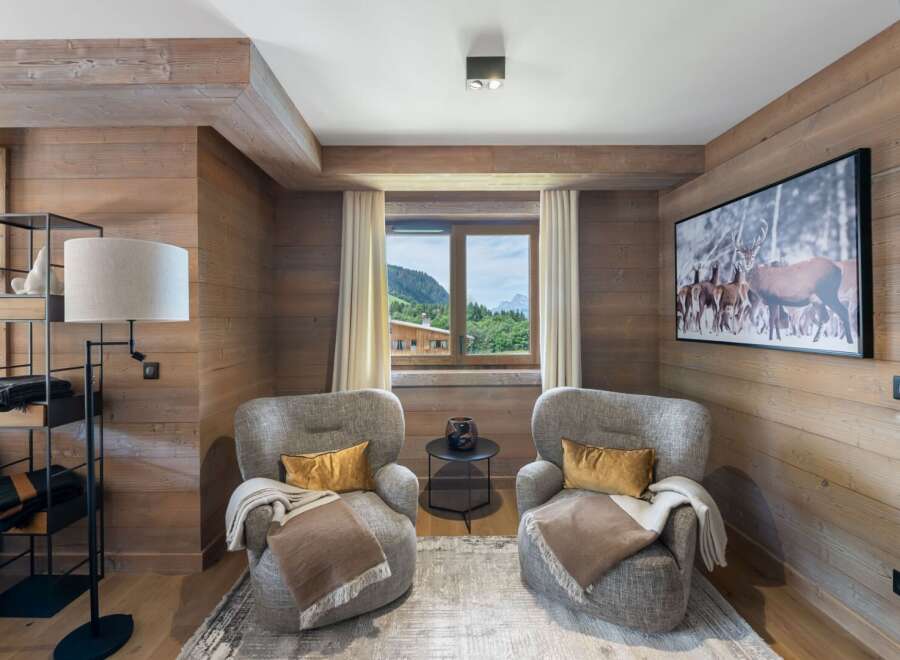 This cozy living space features a rustic wood-paneled interior, creating a warm and inviting atmosphere.
