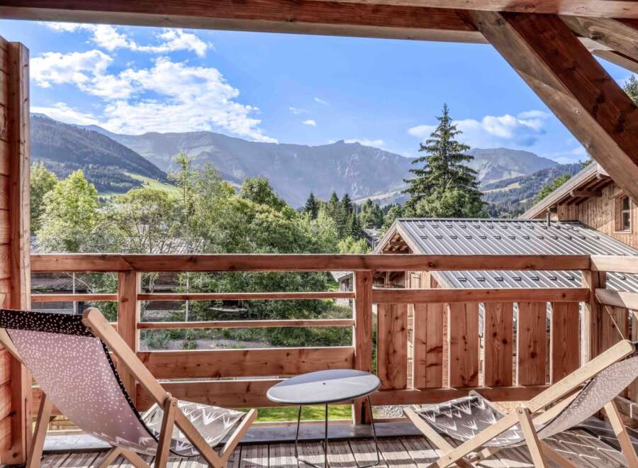 Enjoy breathtaking mountain views from this charming balcony.
