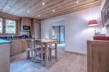 This stunning kitchen boasts a warm and inviting atmosphere with its wooden ceiling and cabinetry.