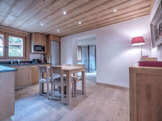 This stunning kitchen boasts a warm and inviting atmosphere with its wooden ceiling and cabinetry.