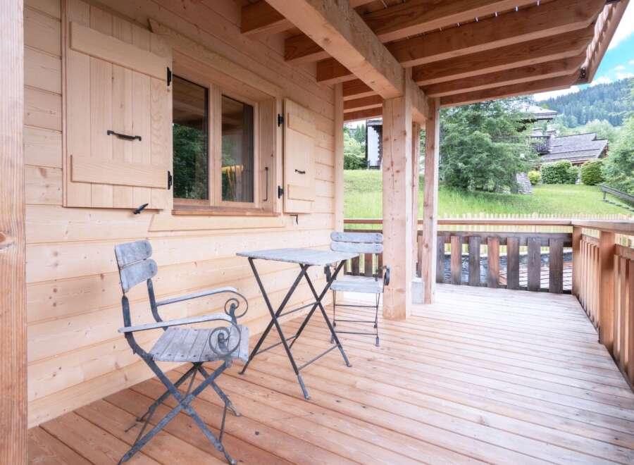 Enjoy the tranquility of this charming wooden cabin, perfect for a relaxing getaway.
