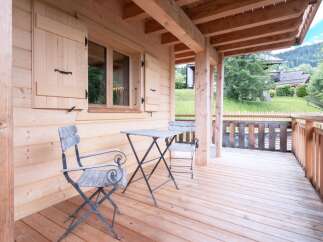 Enjoy the tranquility of this charming wooden cabin, perfect for a relaxing getaway.