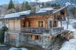 Discover the charm of this stunning wooden chalet nestled in a picturesque mountain setting.