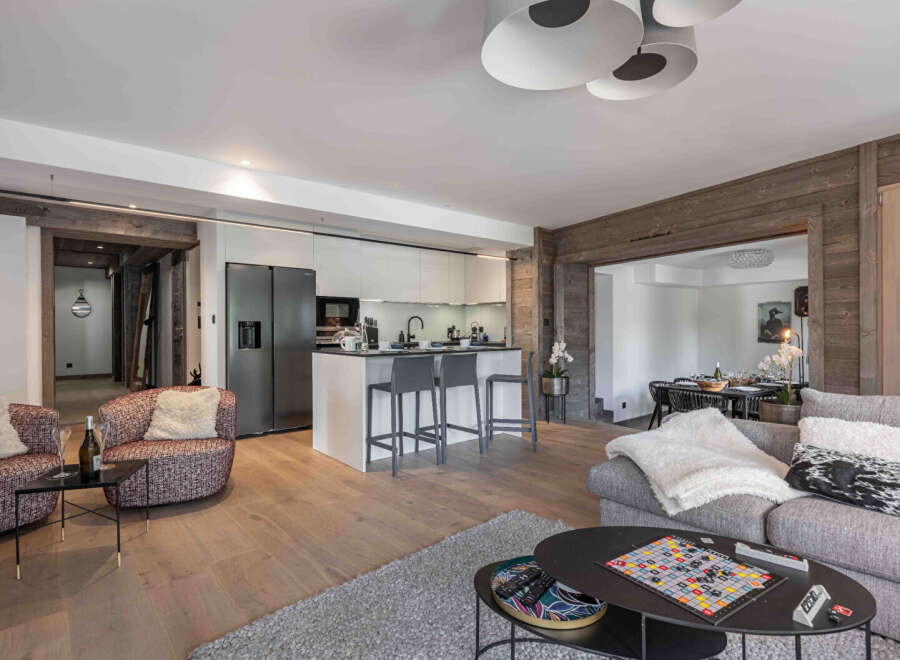 This stunning property features a modern kitchen with sleek cabinetry and a breakfast bar, perfect for entertaining.