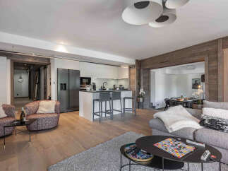 This stunning property features a modern kitchen with sleek cabinetry and a breakfast bar, perfect for entertaining.