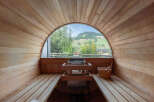 Experience ultimate relaxation in this stunning sauna with breathtaking mountain views.