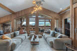 Experience luxury living in this stunning property, featuring a spacious living room with a cozy seating area.
