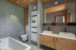This stunning bathroom features a modern design with a touch of rustic charm.