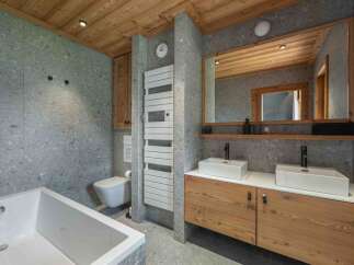 This stunning bathroom features a modern design with a touch of rustic charm.