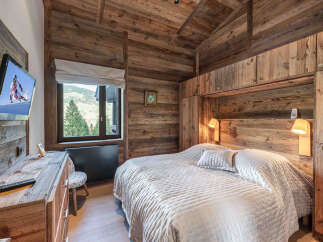 Experience rustic luxury in this stunning bedroom.