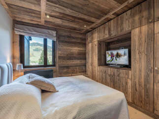Experience rustic luxury in this stunning bedroom.