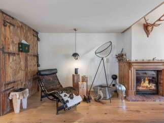 Step into rustic elegance with this stunning property, featuring a cozy fireplace perfect for chilly evenings.