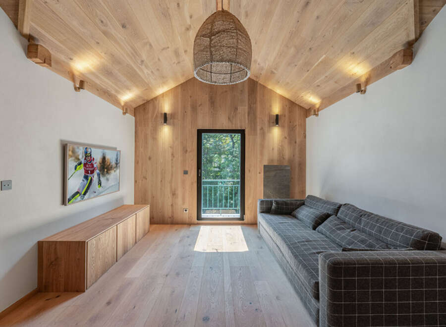 This stunning property boasts a modern interior design with a focus on natural materials.