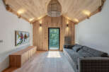This stunning property boasts a modern interior design with a focus on natural materials.