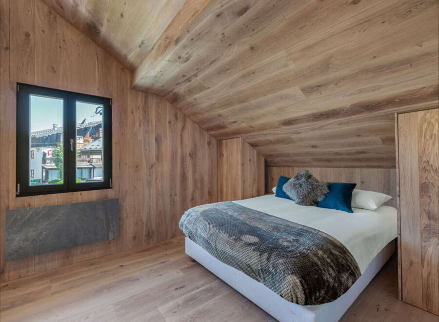 Experience the epitome of rustic elegance in this stunning bedroom.