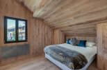 Experience the epitome of rustic elegance in this stunning bedroom.