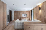 This stunning living space showcases a modern design with a focus on natural materials.
