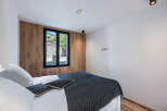 This stunning bedroom boasts a modern design with a touch of natural elegance.