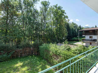 Enjoy breathtaking views from this charming property, surrounded by lush greenery and mature trees.