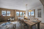 Experience luxury living in this stunning property, featuring a spacious dining area perfect for entertaining.