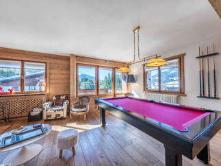This stunning property boasts a luxurious game room, perfect for entertaining guests or enjoying a relaxing evening.