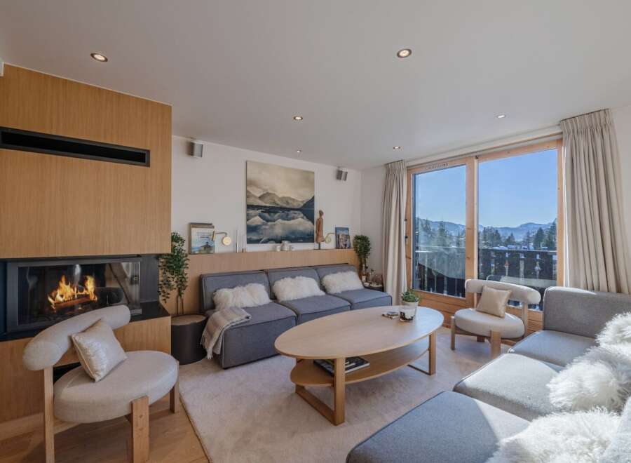Experience luxury living in this stunning property, featuring a cozy fireplace and a modern, open-plan design.