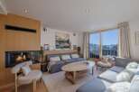 Experience luxury living in this stunning property, featuring a cozy fireplace and a modern, open-plan design.